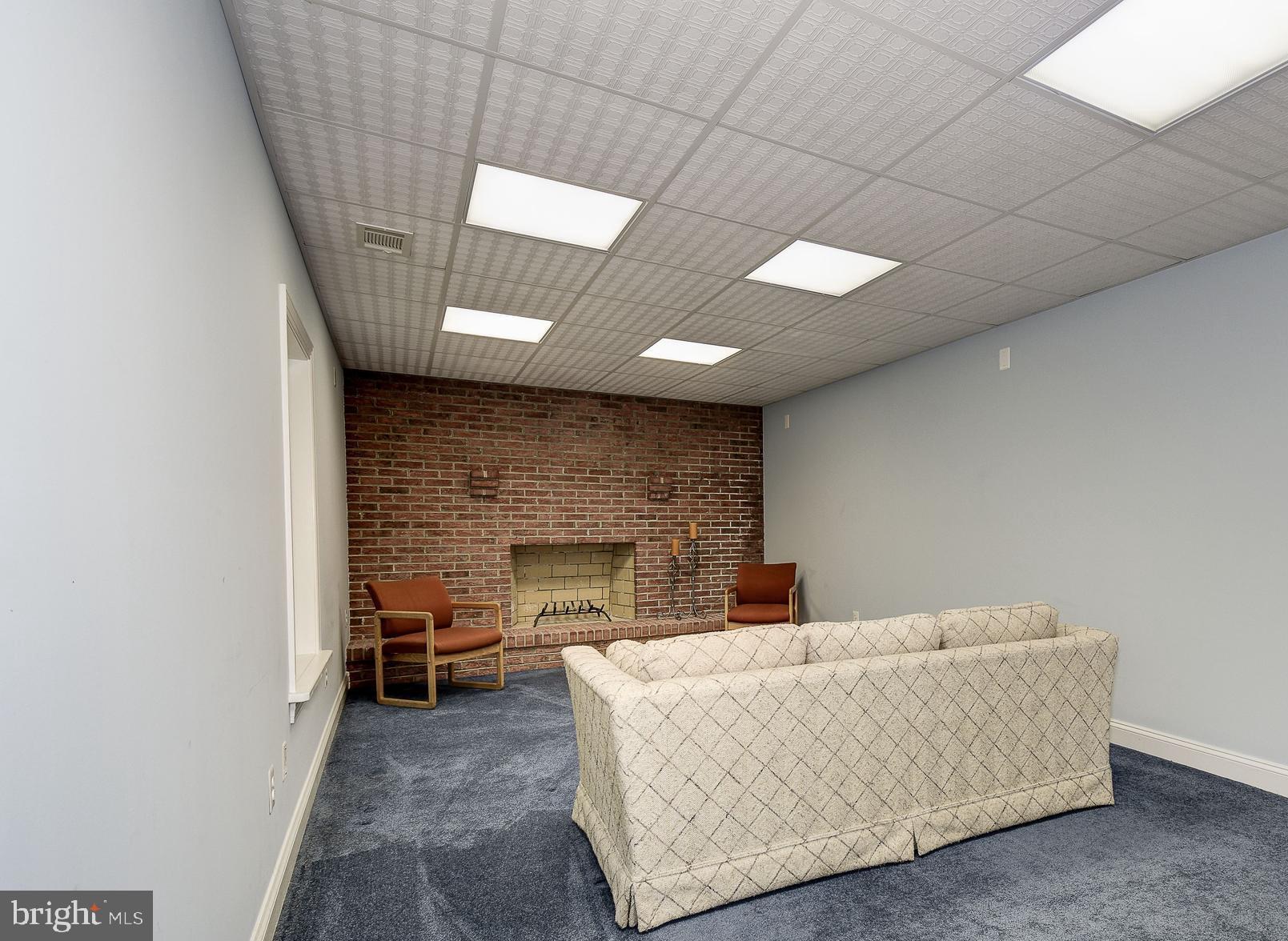 10920 Ward Road Dunkirk, MD 20754 - Photo 42 of 63 a living room with furniture and a fireplace