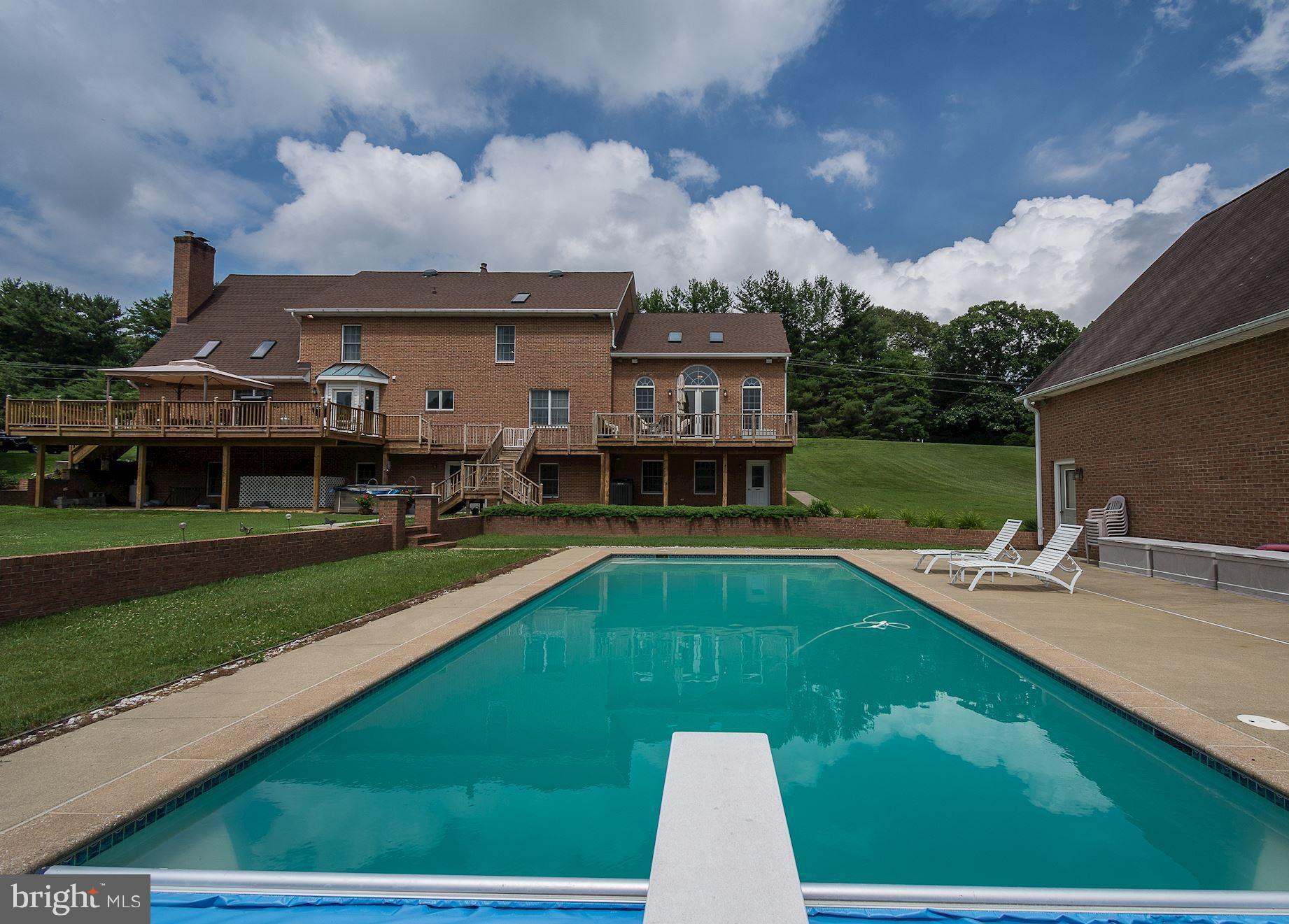10920 Ward Road Dunkirk, MD 20754 - Photo 52 of 63 a view of a house with a swimming pool