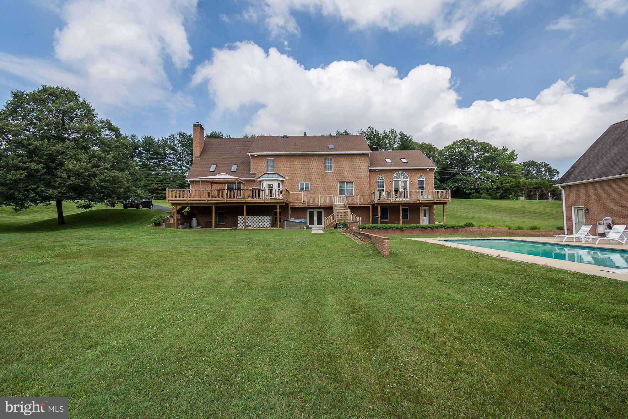 10920 Ward Road Dunkirk, MD 20754 - Photo 54 of 63 a view of a house with a big yard and large trees