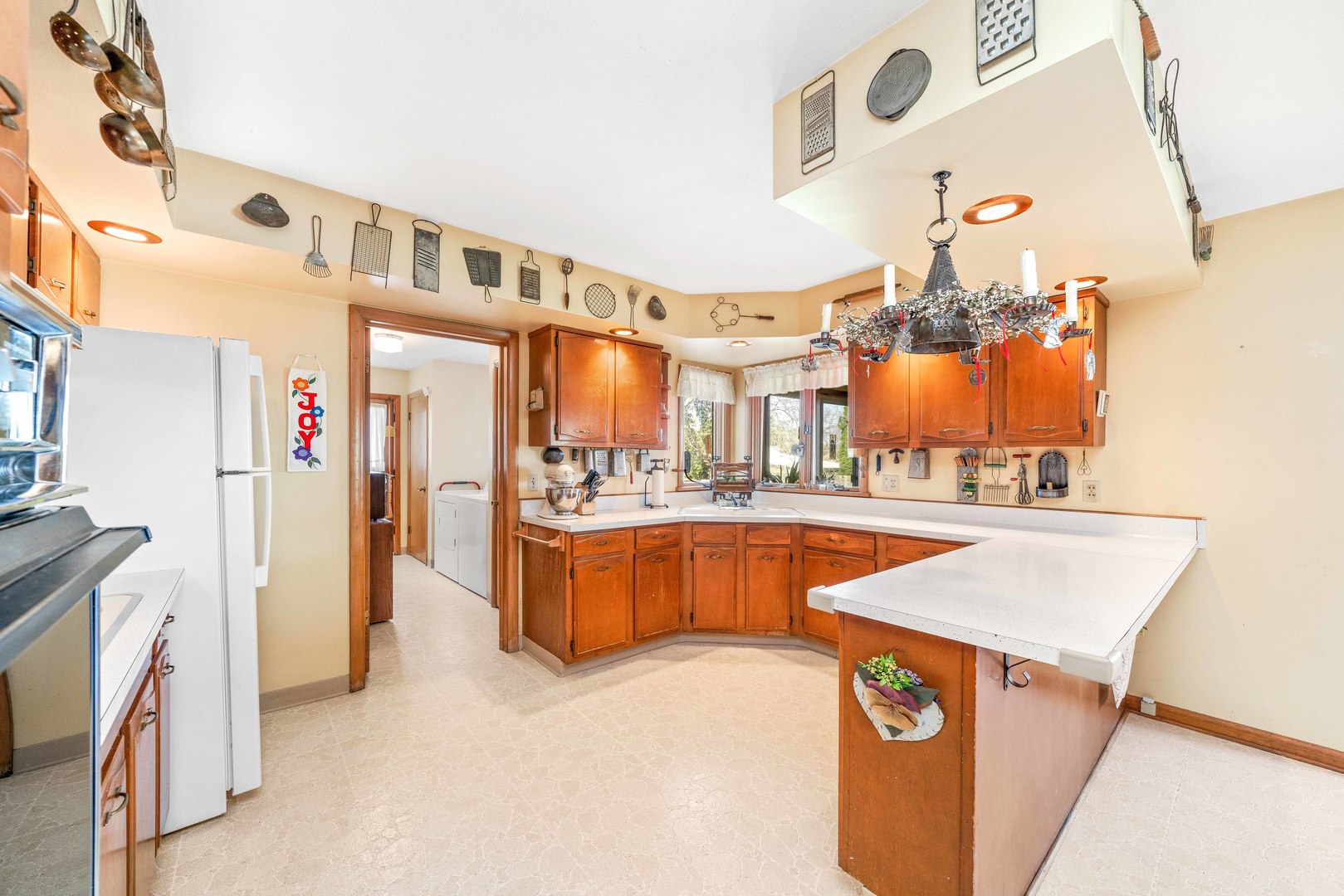 808 Normal Road DeKalb, IL 60115 - Photo 11 of 29 a view of living room with stainless steel appliances kitchen island granite countertop a refrigerator a stove and a sink