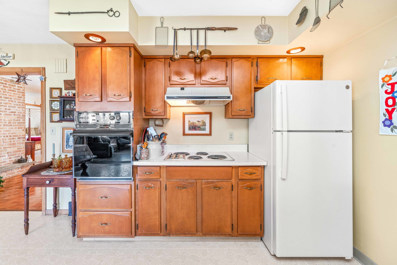 808 Normal Road DeKalb, IL 60115 - Photo 12 of 29 a kitchen with stainless steel appliances granite countertop a refrigerator a stove and a sink with chandelier