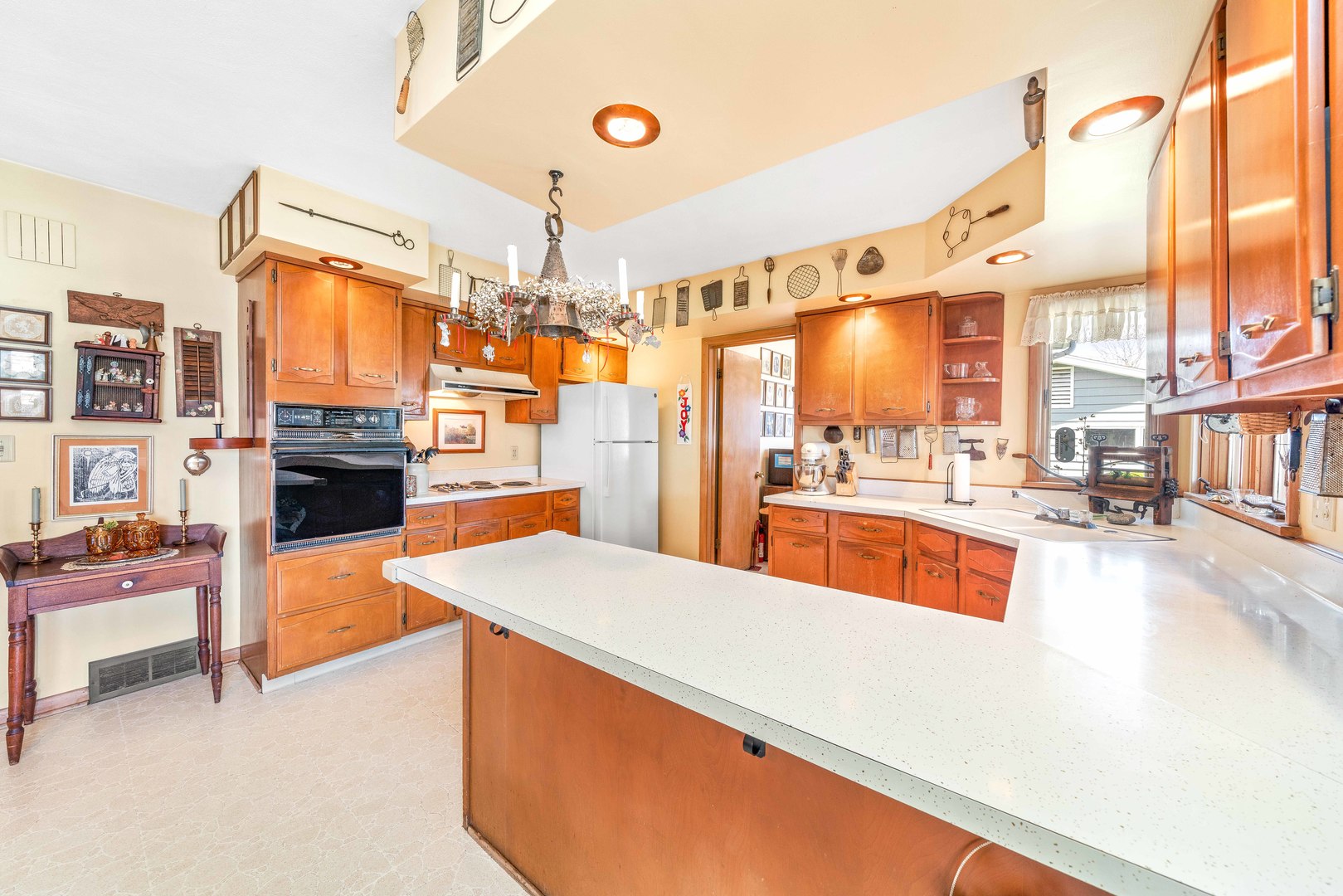 808 Normal Road DeKalb, IL 60115 - Photo 14 of 29 a large white kitchen with a large window