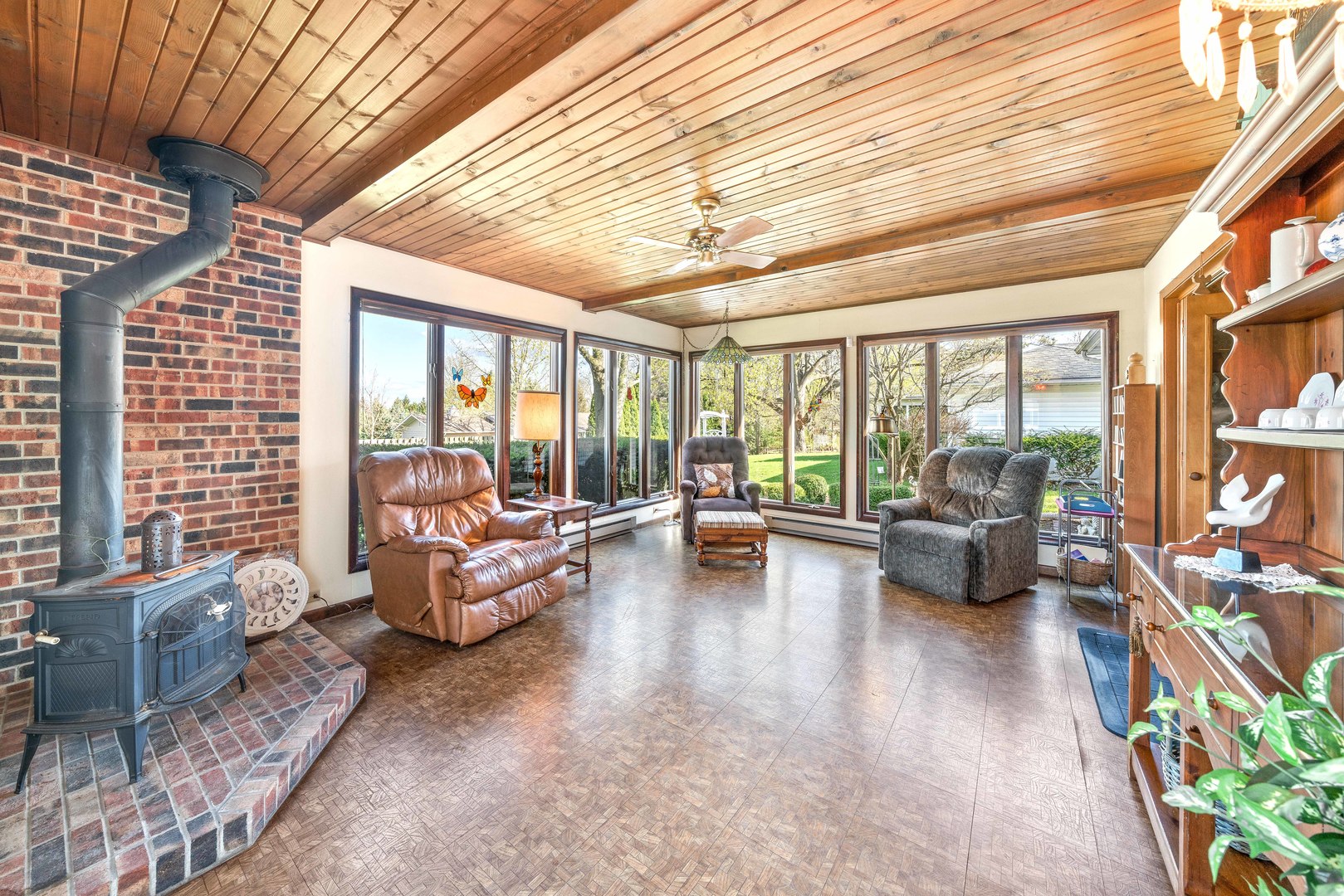 808 Normal Road DeKalb, IL 60115 - Photo 18 of 29 a living room with furniture and floor to ceiling windows