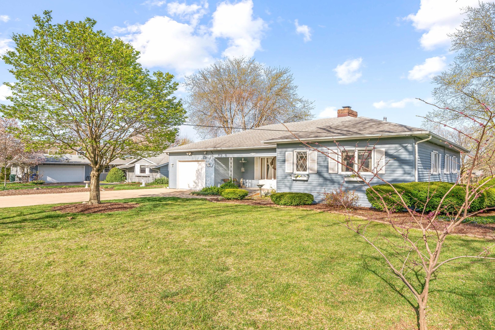 808 Normal Road DeKalb, IL 60115 - Photo 2 of 29 a front view of a house with swimming pool having outdoor seating