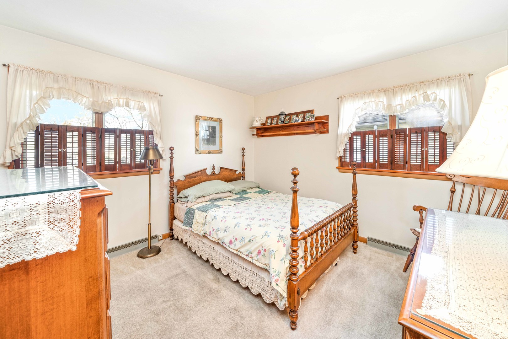 808 Normal Road DeKalb, IL 60115 - Photo 22 of 29 a bedroom with a bed next to a large window with the outer view