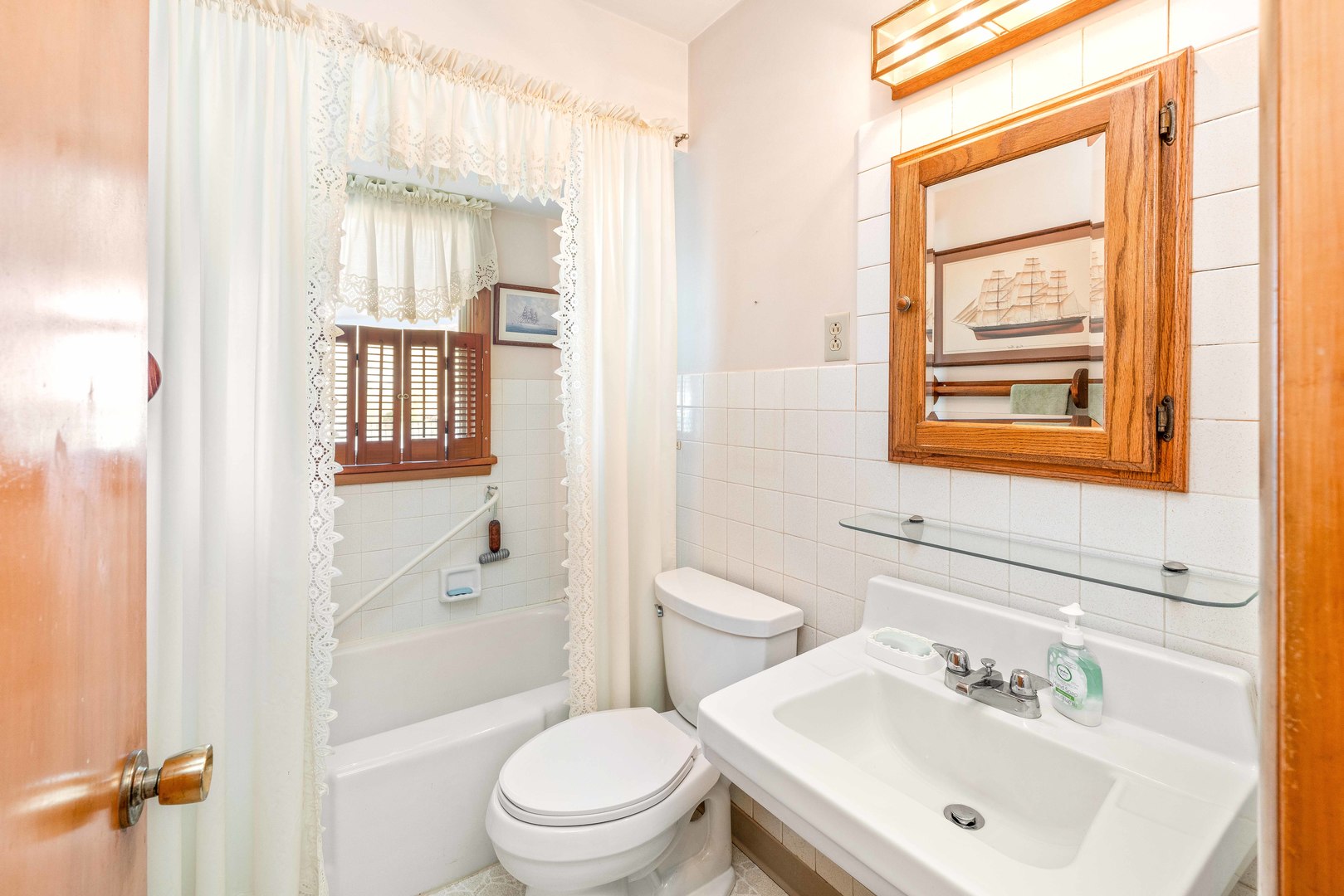 808 Normal Road DeKalb, IL 60115 - Photo 23 of 29 a bathroom with a sink a toilet and shower