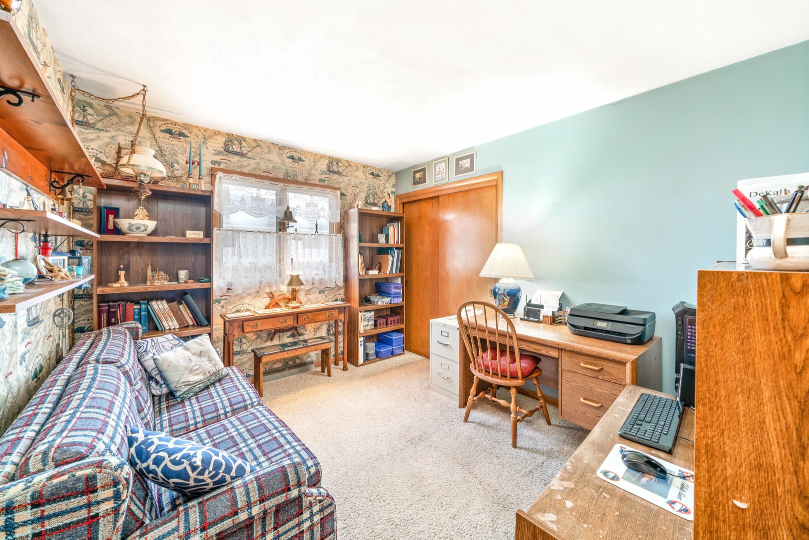 808 Normal Road DeKalb, IL 60115 - Photo 24 of 29 a living room with furniture a rug and a table