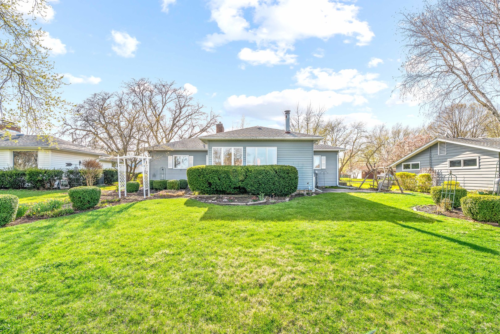 808 Normal Road DeKalb, IL 60115 - Photo 27 of 29 a view of a house with a big yard and large trees