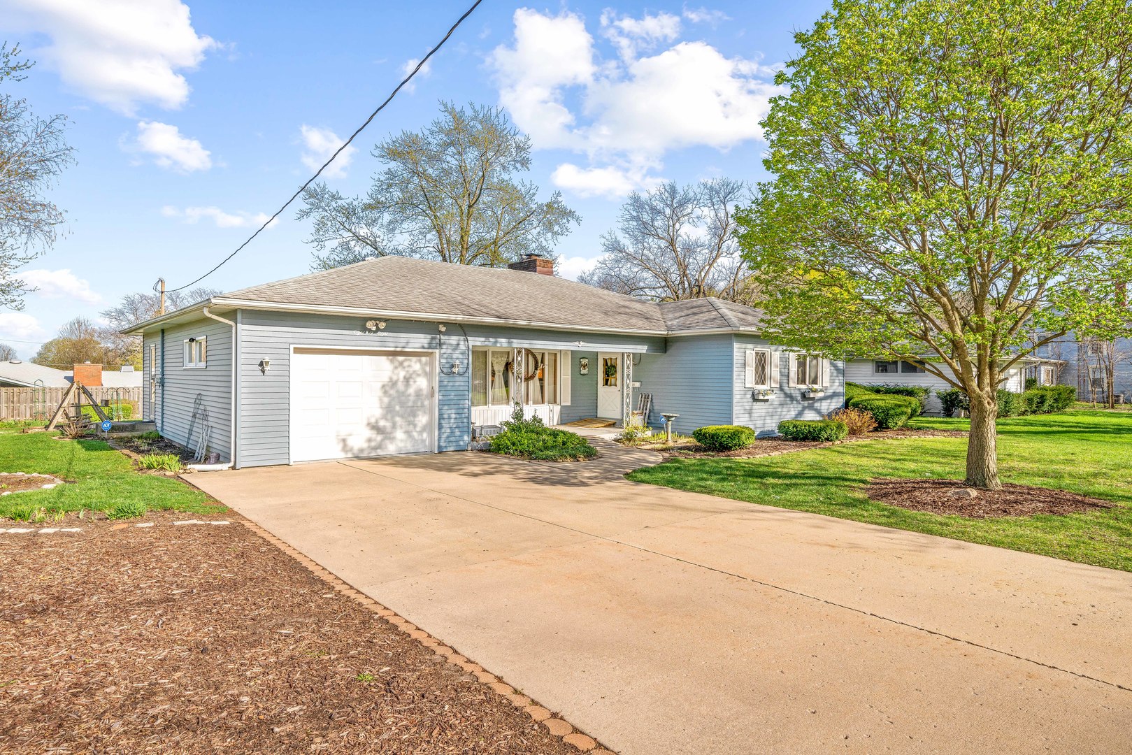 808 Normal Road DeKalb, IL 60115 - Photo 3 of 29 a view of a house with a yard and large tree