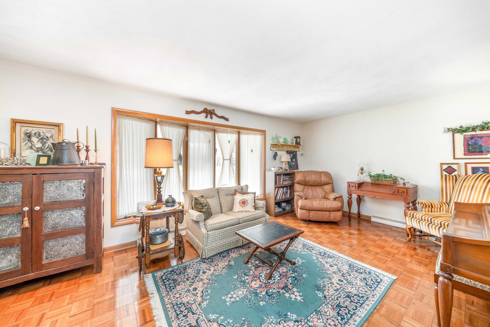 808 Normal Road DeKalb, IL 60115 - Photo 8 of 29 a living room with furniture and a rug