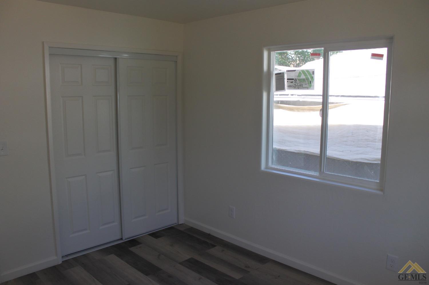 Undisclosed Address Wasco, CA 93280 - Photo 17 of 26 an empty room with a window