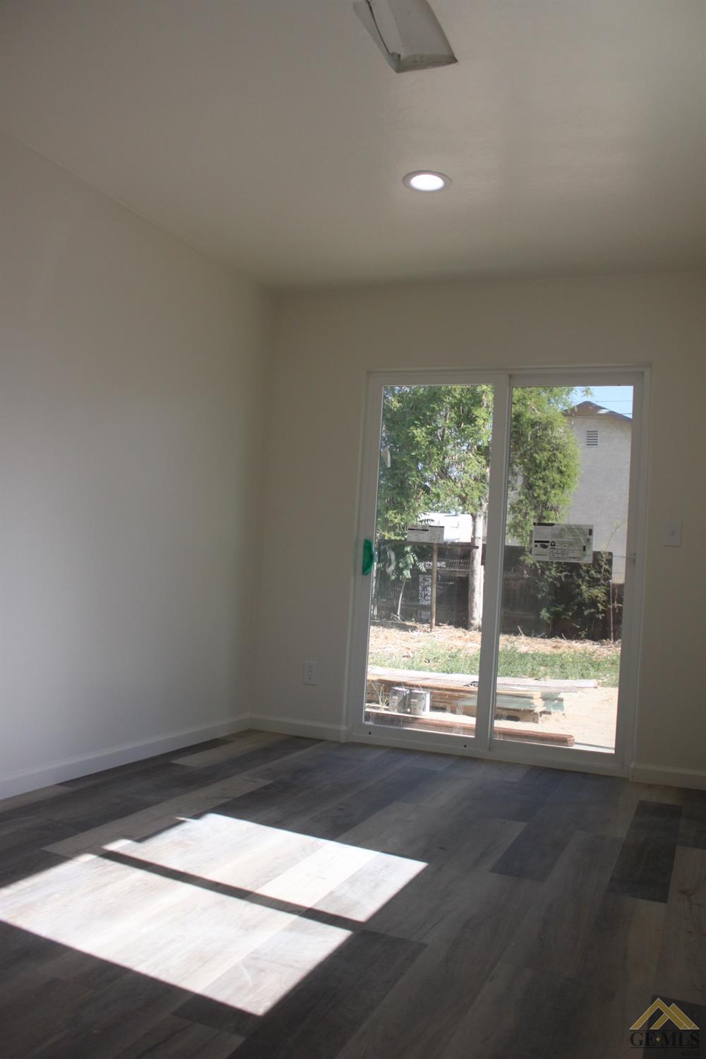 Undisclosed Address Wasco, CA 93280 - Photo 20 of 26 a view of an empty room with a window