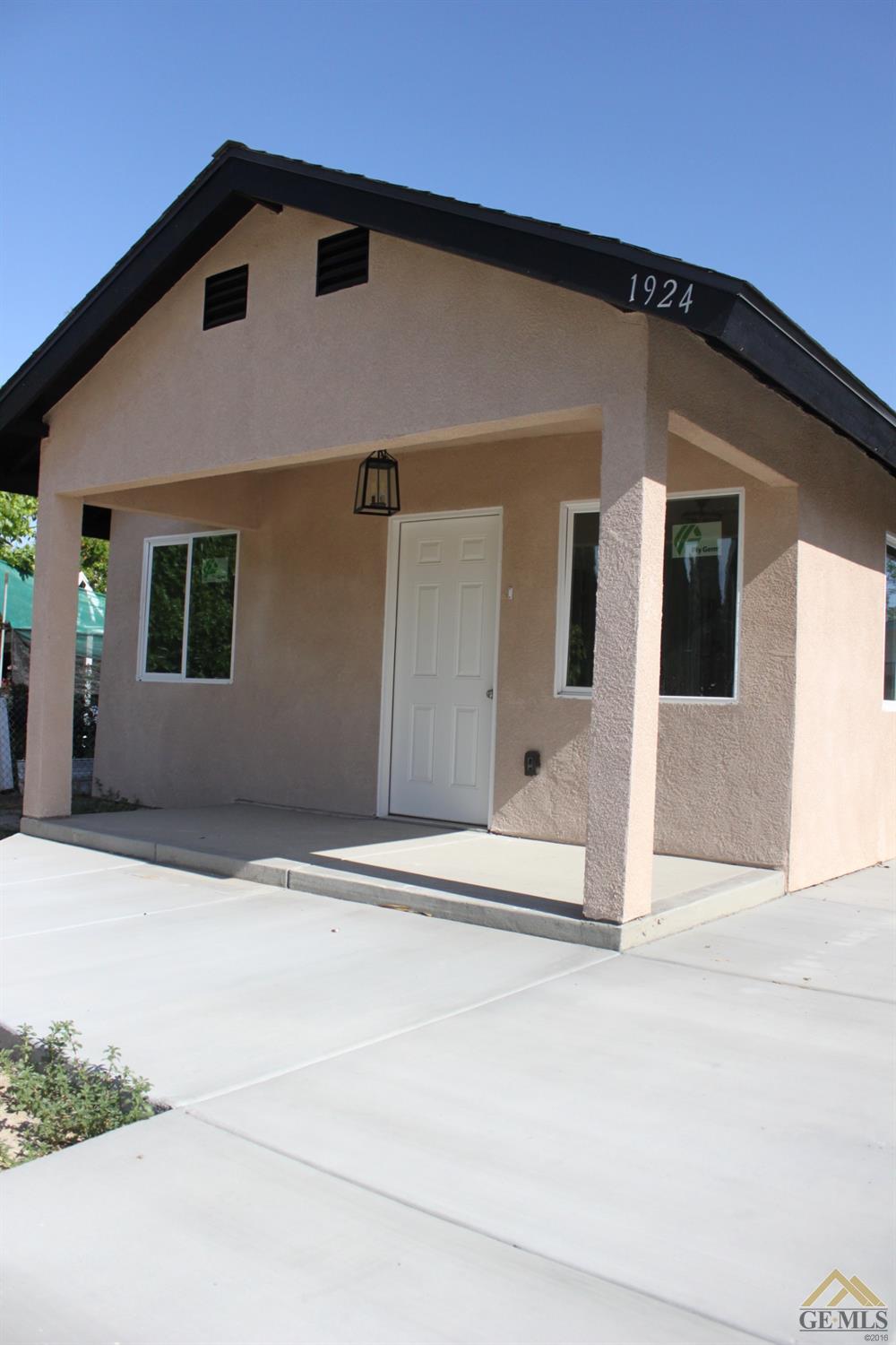 Undisclosed Address Wasco, CA 93280 - Photo 25 of 26 a front view of a house with a garage