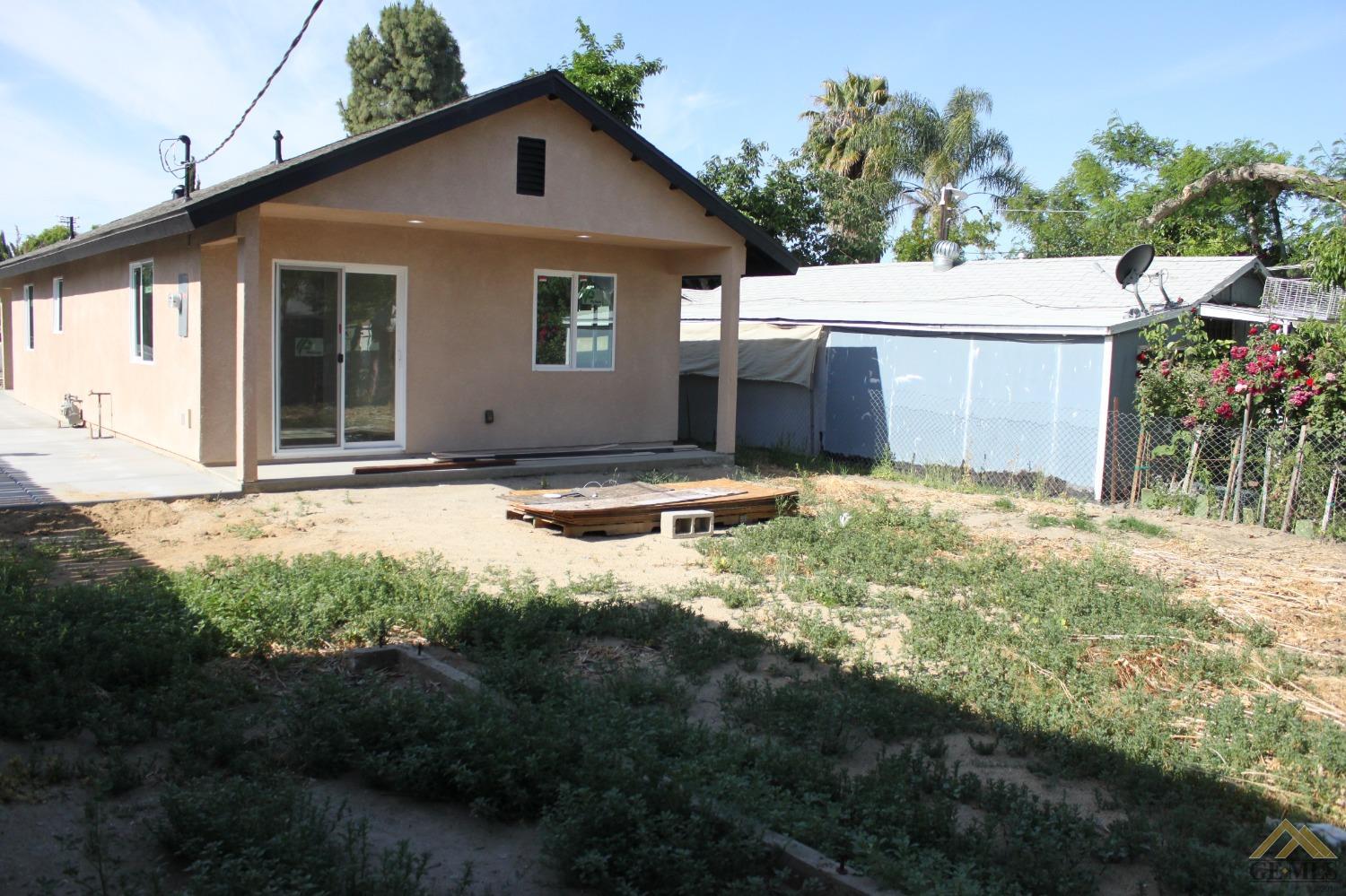 Undisclosed Address Wasco, CA 93280 - Photo 4 of 26 a view of backyard of house with green space