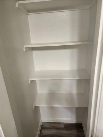 a view of an empty walk in closet