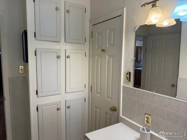 a bathroom with a sink and mirror