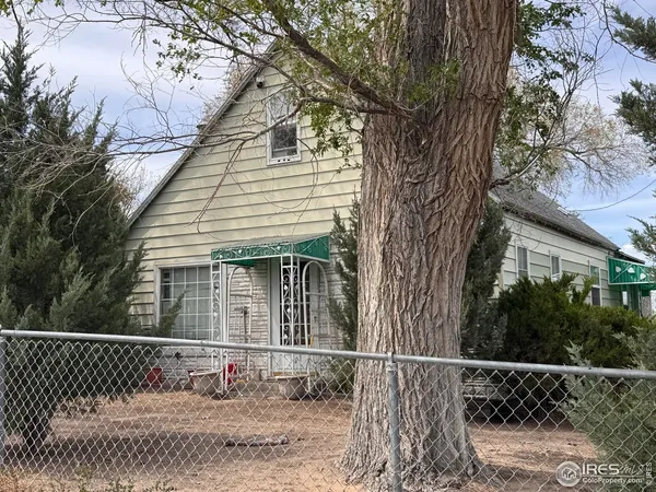 a view of a house with a fence