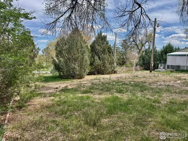 a fire hydrant in the middle of a field