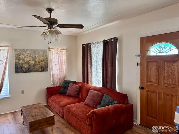 a living room with furniture and a window