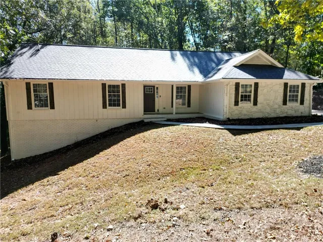 a house with trees in the background