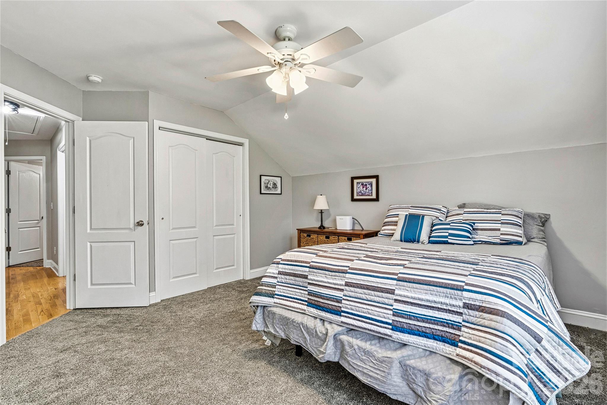 1606 High Ridge Drive Stanley, NC 28164 - Photo 25 of 44 a bedroom with bed and a chandelier