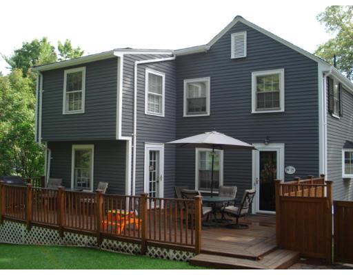 11 Oak Ridge Road Reading, MA 01867 - Photo 11 of 13 a front view of house with yard outdoor seating and barbeque oven