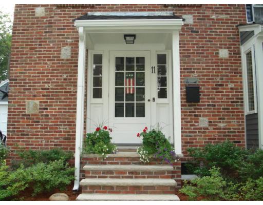 11 Oak Ridge Road Reading, MA 01867 - Photo 13 of 13 a front view of a house with potted plants