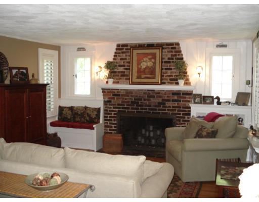 11 Oak Ridge Road Reading, MA 01867 - Photo 2 of 13 a living room with furniture and a fireplace