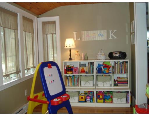11 Oak Ridge Road Reading, MA 01867 - Photo 6 of 13 a room with toys and a shelf