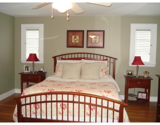 11 Oak Ridge Road Reading, MA 01867 - Photo 8 of 13 a bedroom with a bed and a lamp on dresser
