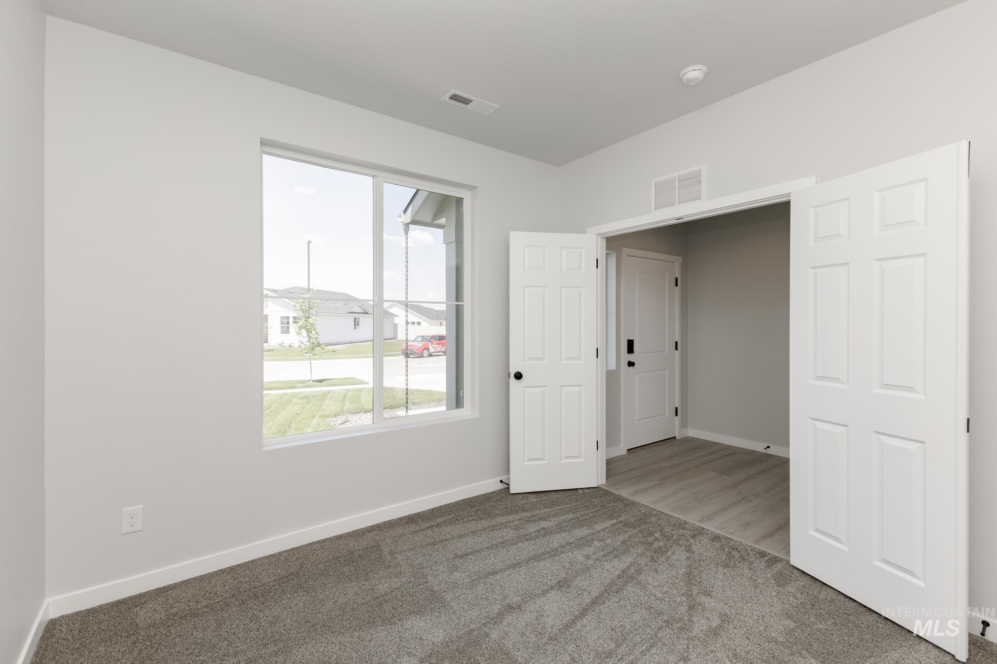 3218 North Waterbrook Way Star, ID 83669 - Photo 11 of 27 Carpeted spare room featuring baseboards