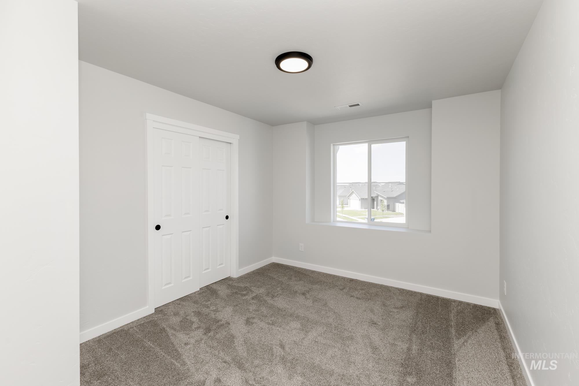 3218 North Waterbrook Way Star, ID 83669 - Photo 16 of 27 Unfurnished bedroom with carpet and a closet