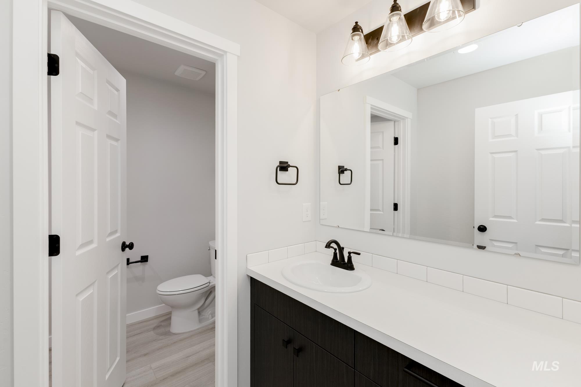 3218 North Waterbrook Way Star, ID 83669 - Photo 20 of 27 Bathroom with vanity and light wood finished floors