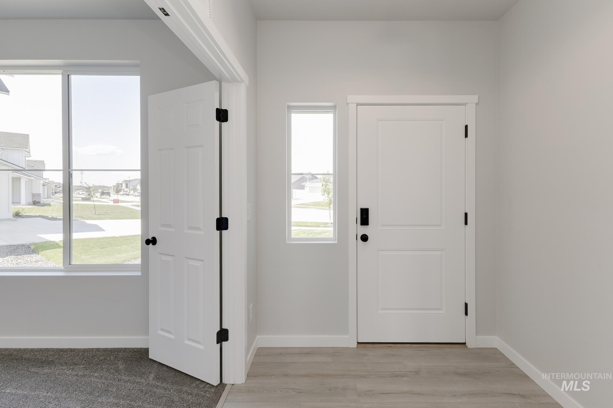3218 North Waterbrook Way Star, ID 83669 - Photo 2 of 27 Foyer entrance featuring baseboards and light wood-type flooring