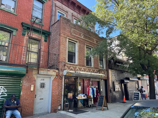 a view of a building with a tree
