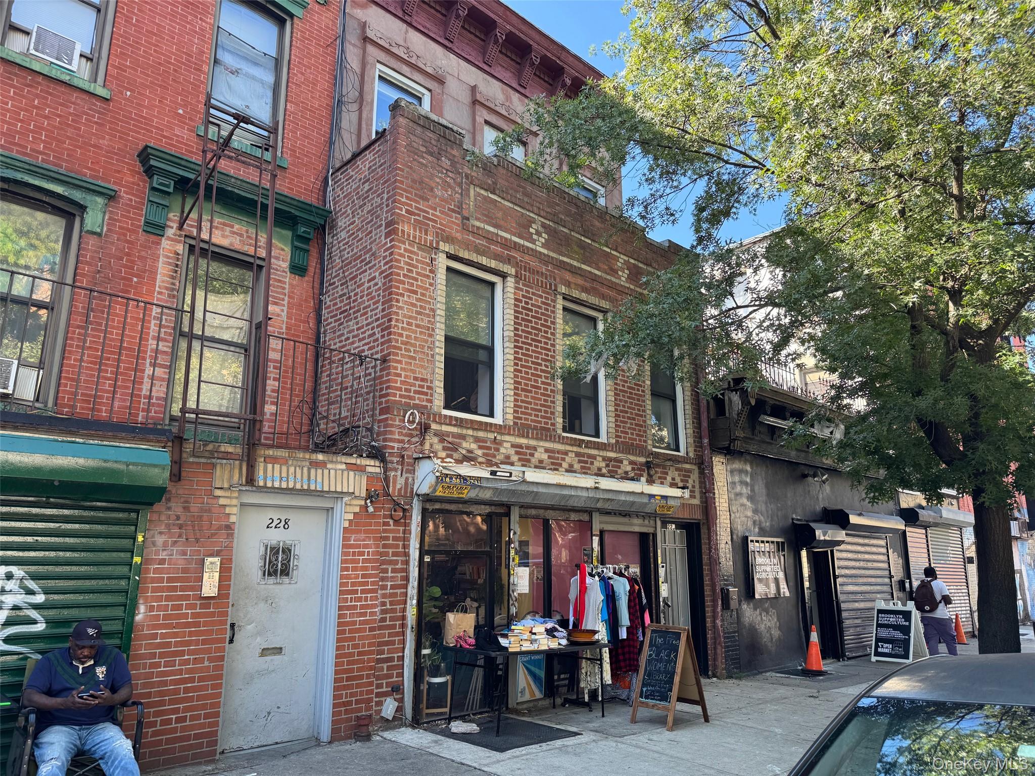 a view of a building with a tree