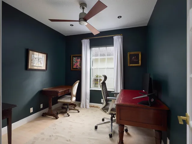 a view of a workspace with furniture