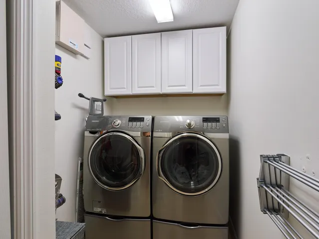 a utility room with dryer and washer