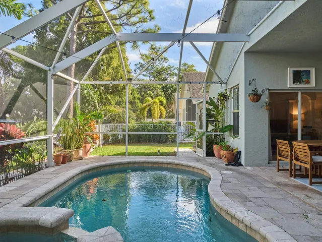 a view of swimming pool with seating area