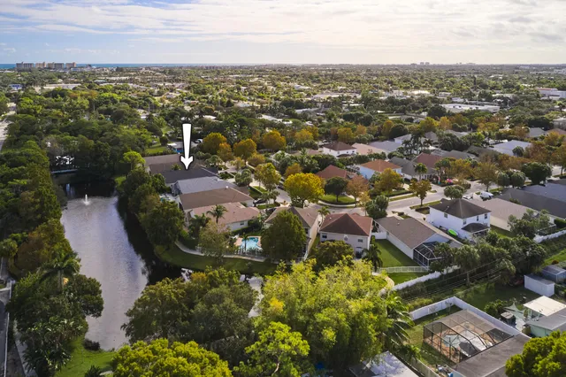 an aerial view of residential houses with outdoor space