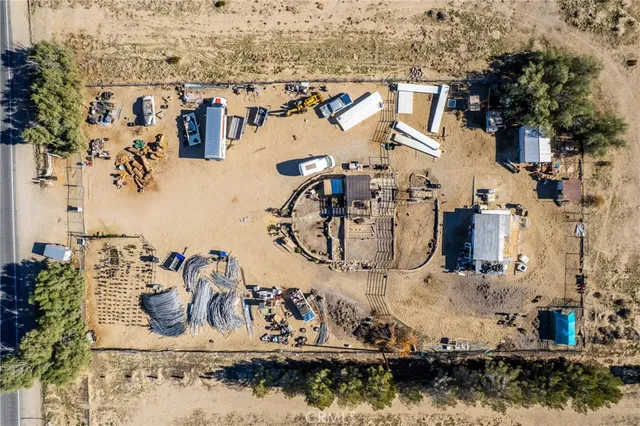 an aerial view of residential house and sandy dunes
