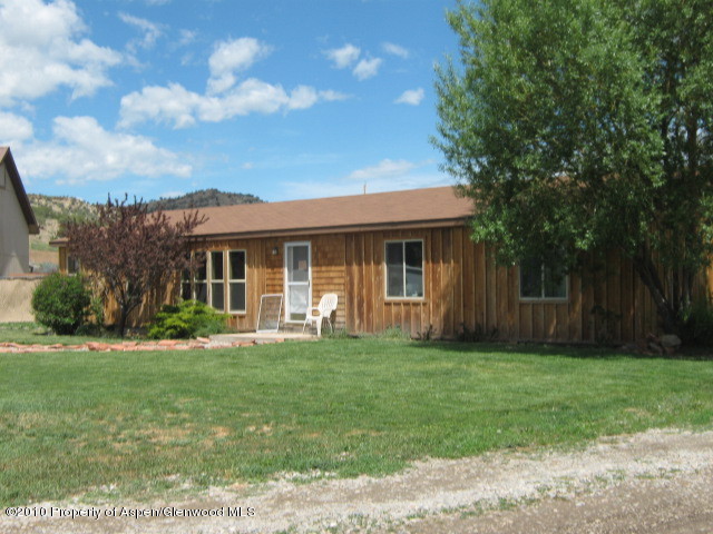 2920 County Road 233 Rifle, CO 81650 - Photo 1 of 13 a view of a house with a yard
