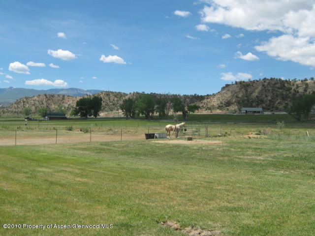 2920 County Road 233 Rifle, CO 81650 - Photo 8 of 13 a view of a lake with a yard