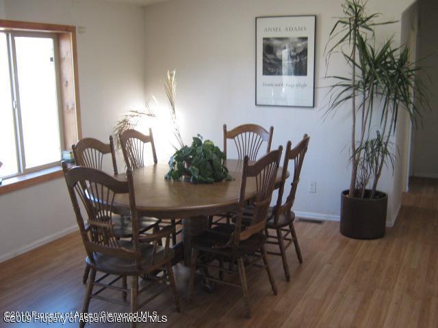 2920 County Road 233 Rifle, CO 81650 - Photo 9 of 13 a view of a dining room with furniture and wooden floor