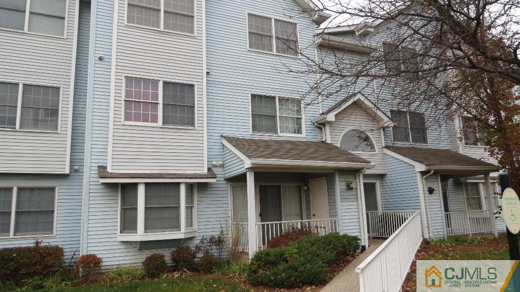 216 Edpas Road New Brunswick, NJ 08901 - Photo 1 of 18 a front view of a house with a yard and potted plants