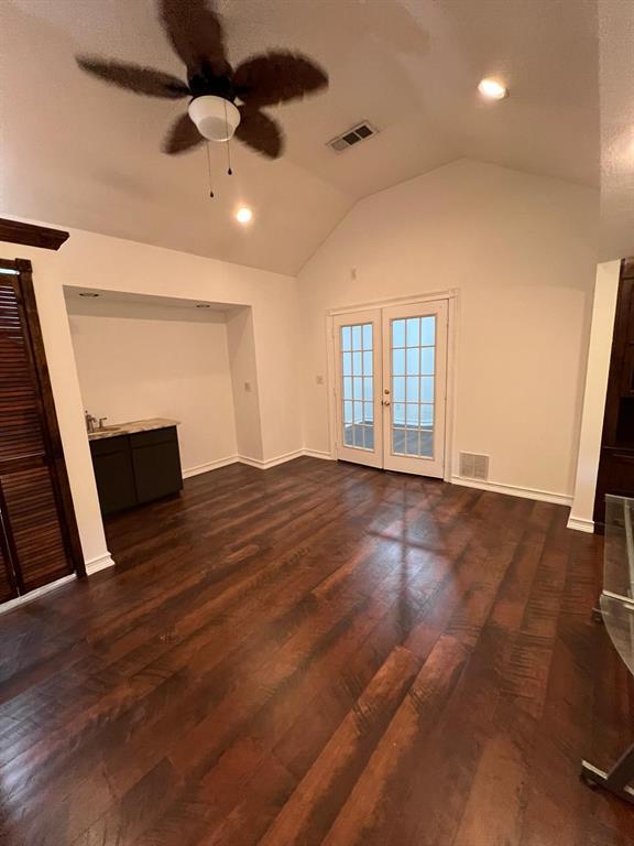 6707 Elam Road Dallas, TX 75217 - Photo 11 of 18 a view of empty room with wooden floor and fan