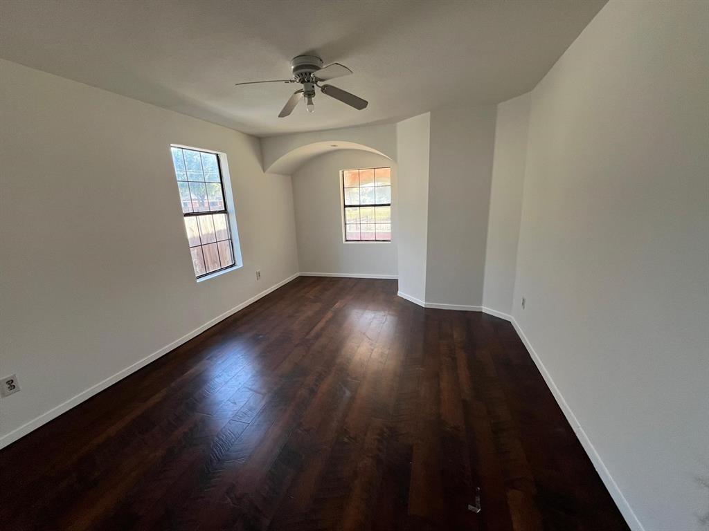 6707 Elam Road Dallas, TX 75217 - Photo 3 of 18 wooden floor in an empty room with a window