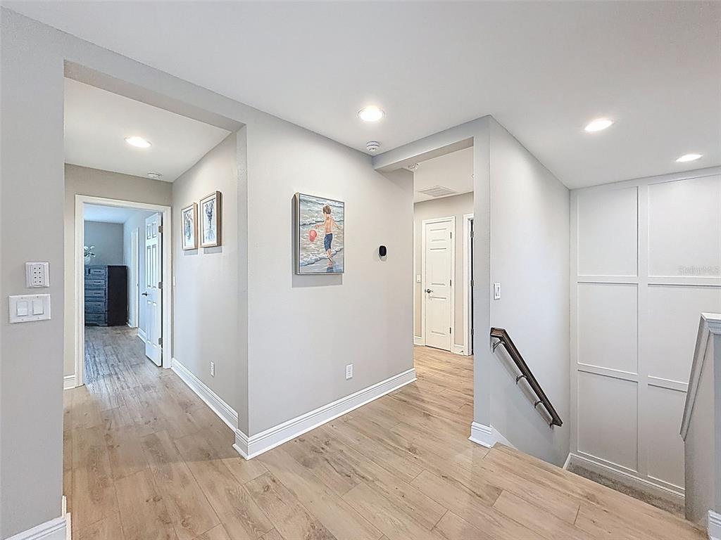 4312 Burdick Loop Odessa, FL 33556 - Photo 23 of 55 a view of a hallway with wooden floor