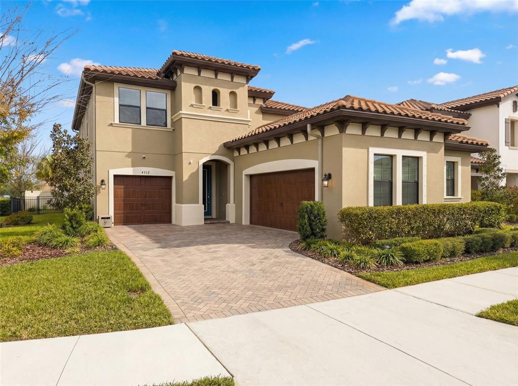 4312 Burdick Loop Odessa, FL 33556 - Photo 3 of 55 a front view of a house with a garden