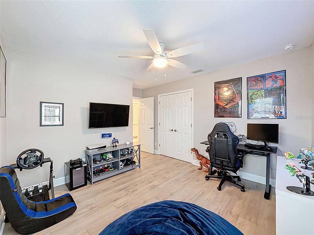 4312 Burdick Loop Odessa, FL 33556 - Photo 34 of 55 a living room with furniture and a flat screen tv